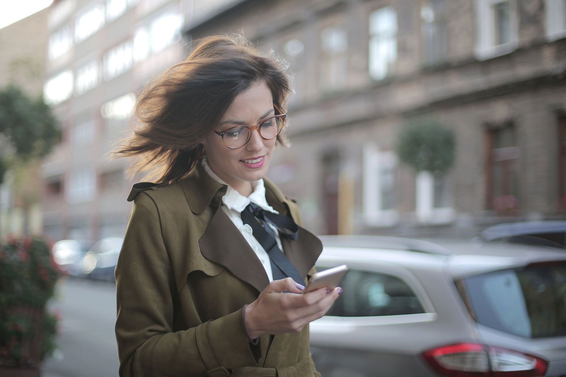 image of girl looking at her mobile